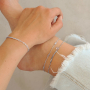 Comment combiner les cha&icirc;nes de cheville et les bracelets cet &eacute;t&eacute; ?