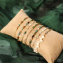 Cr&eacute;ez de magnifiques bijoux avec les perles en verre &agrave; bord dor&eacute;