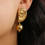 Inspiration avec des boucles d'oreilles et pendentifs en acier inoxydable