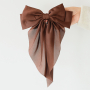 Mix & match votre collection avec des chouchous & barrettes &agrave; n&oelig;ud